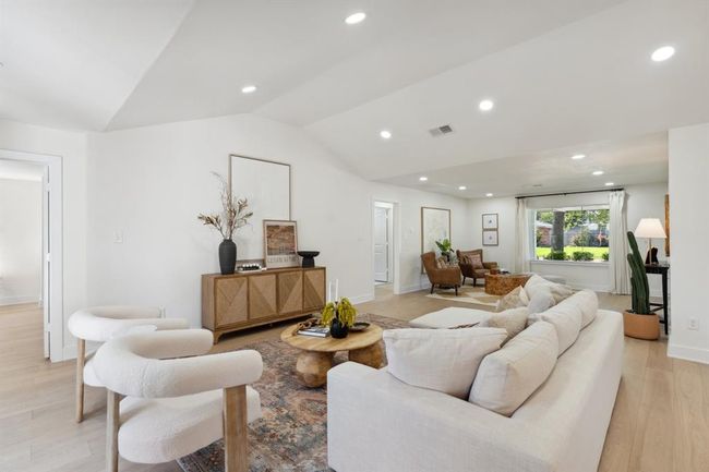 This perspective showcases the seamless flow of the open-concept living area, offering easy access to the surrounding spaces of the home. | Image 5