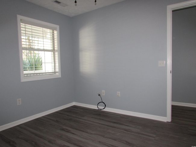 Bedroom with LVP flooring. | Image 13