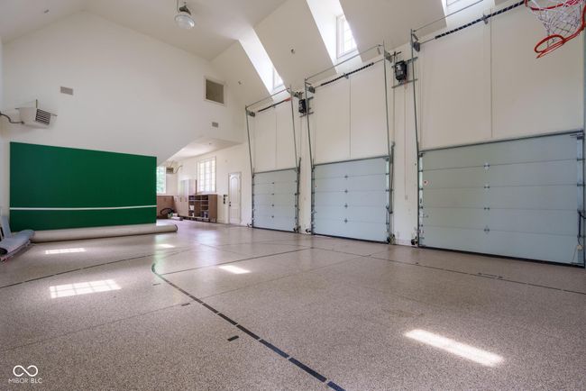 garage featuring a skylight and healthy amount of natural light | Image 117