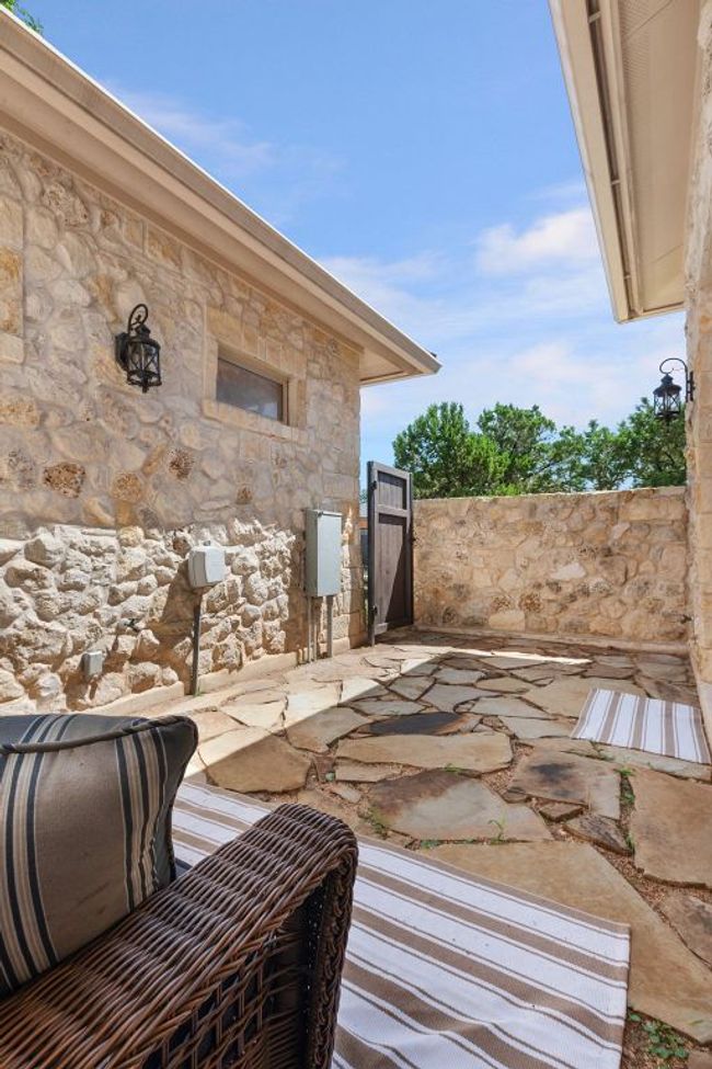 View of patio featuring a gate off primary bathroom | Image 17