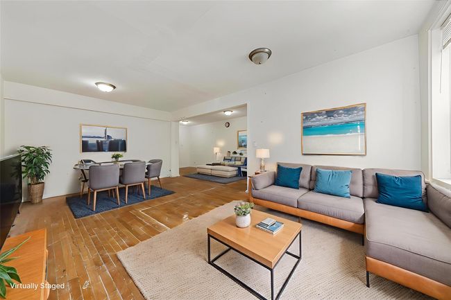Living area with wood finished floors | Image 7