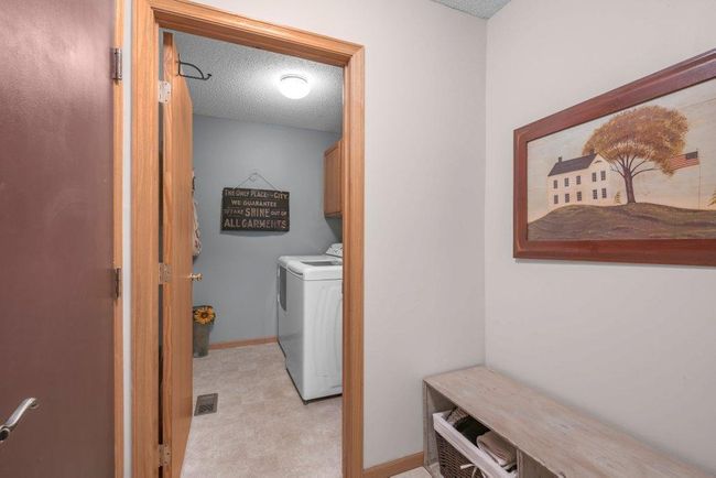 Laundry room area off of the garage helps eliminate debris from going into the property. | Image 12