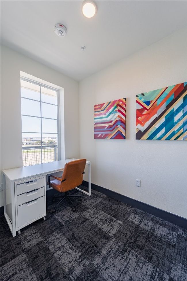 Office space with dark carpet and baseboards | Image 10