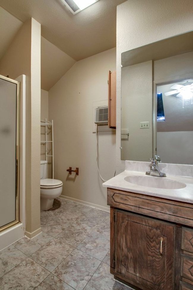 Bathroom with vanity, vaulted ceiling, and a shower stall | Image 21