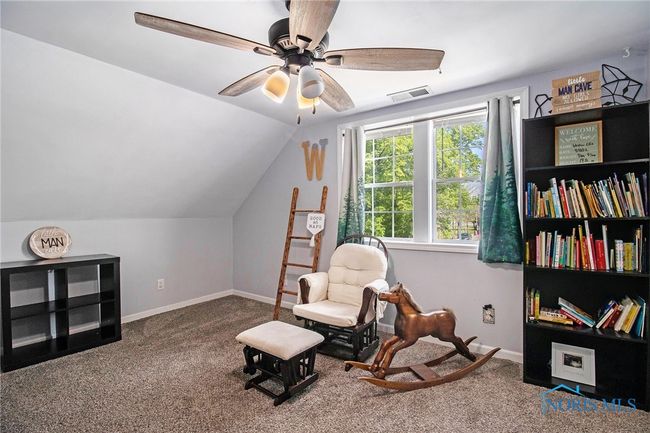 The second upstairs bedroom is even more spacious and features his-and-hers closets, providing excellent storage and organization. | Image 16