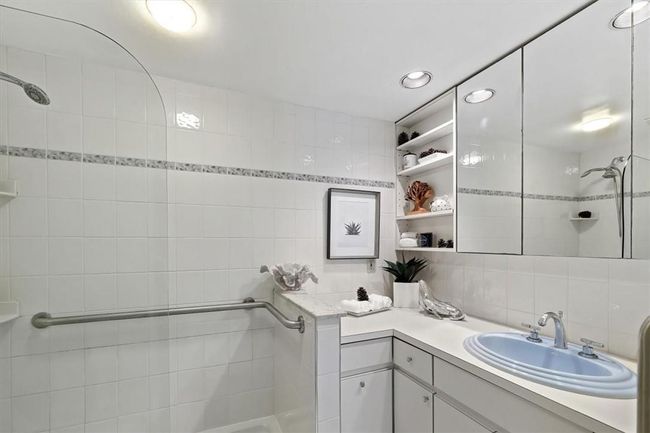 1st Floor Bathroom with tile walls, backsplash, and vanity | Image 14