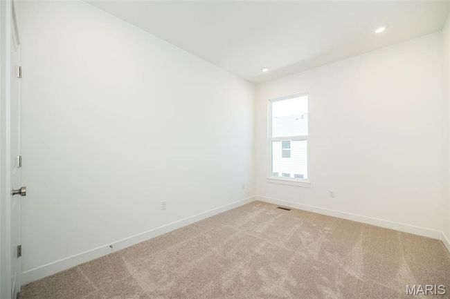 Empty room featuring light colored carpet and recessed lighting | Image 28
