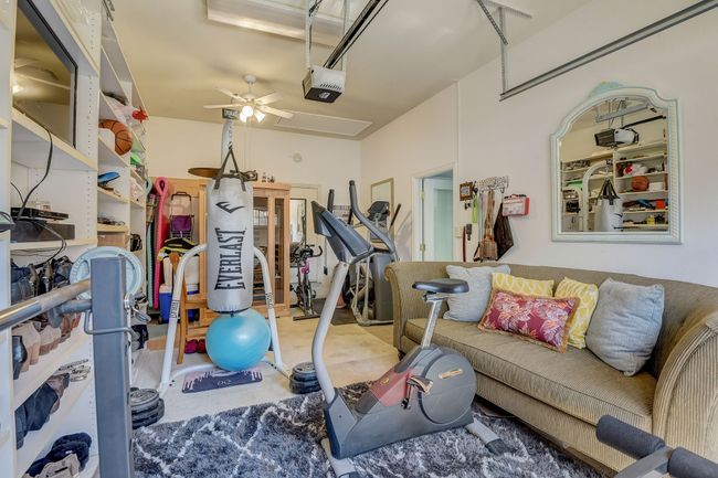 Third garage is used as a home gym and is temperature controlled | Image 37