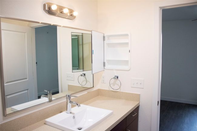Bathroom featuring wood finished floors and vanity | Image 8