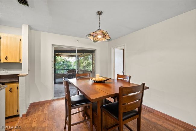 Dining space featuring hardwood / wood-style floors | Image 6