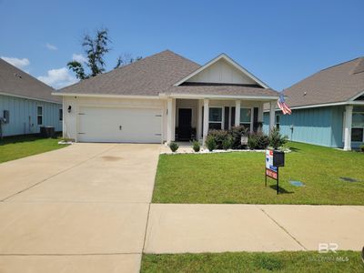 View of front facade featuring a garage and a front yard | Image 1