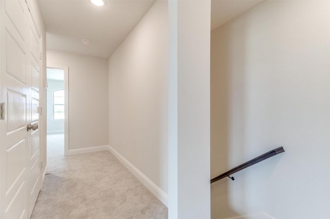Hall featuring light colored carpet | Image 25