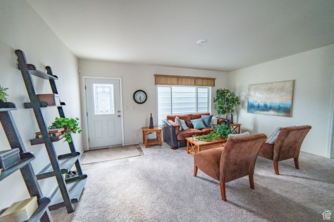 Living room with carpet flooring | Image 44
