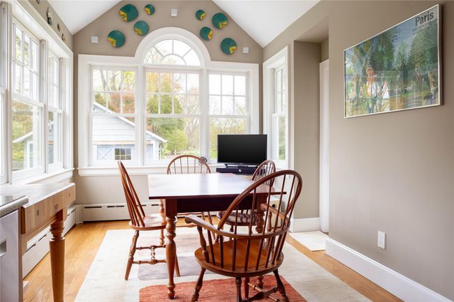 Breakfast Room opening from kitchen with window walls overlooking the back gardens | Image 13