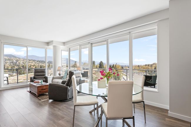 Dining area featuring baseboards, wood finished floors, and a mountain view | Image 8