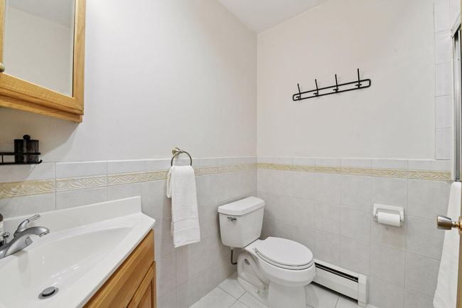 The Primary Bedroom Ensuite has a private ceramic tile 3/4 bath. Your Guests may enjoy a full ceramic tile bathroom with a soaking tub near their Guest Bedroom. | Image 30