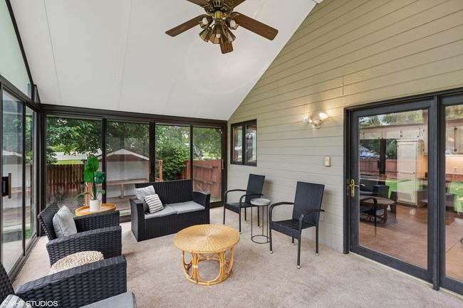 Check out this beautiful 3-season porch—ideal for enjoying the outdoors without leaving the comfort of home | Image 20