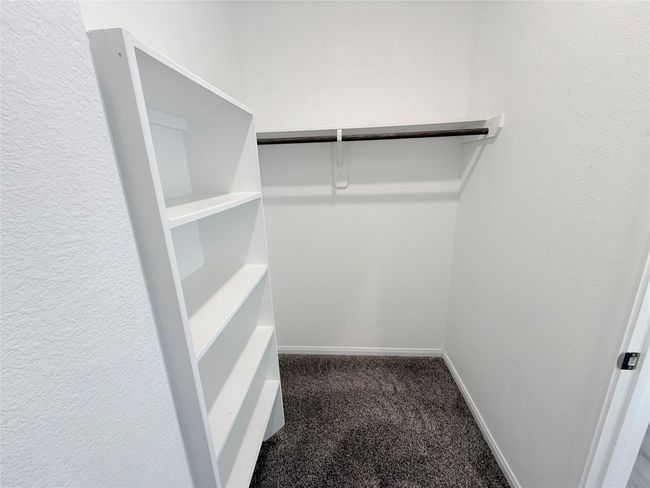 14501 SUGAR PINES DR - Primary bedroom with ensuite bathroom, dual sinks, separate tub and shower, and walk in closet | Image 31