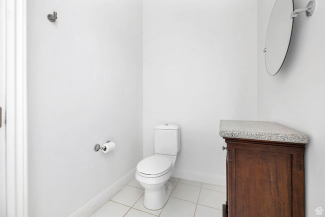 Bathroom featuring baseboards, tile patterned flooring, and toilet | Image 18
