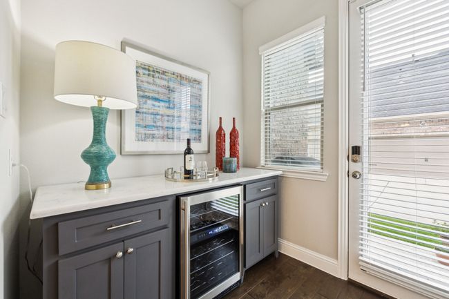 Custom cabinetry wine-butler's pantry complete with two-zone wine fridge. | Image 4