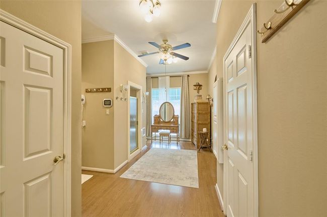 Humongous primary bath. Built-in ironing board & Laundry area within | Image 29