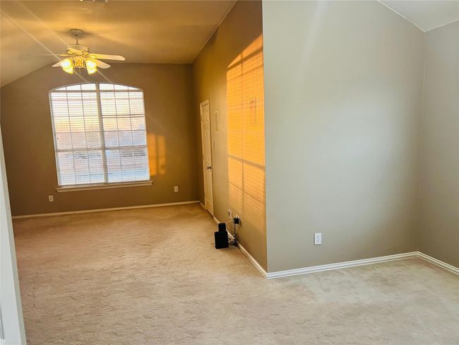 Master Bedroom featuring ceiling fan, light colored carpet, and lofted ceiling | Image 17