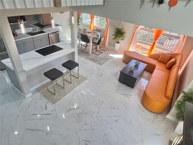Living room with marble finish floor and baseboards | Image 32