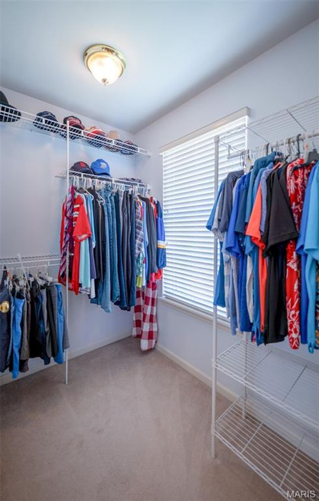 Walk in closet featuring carpet floors | Image 32