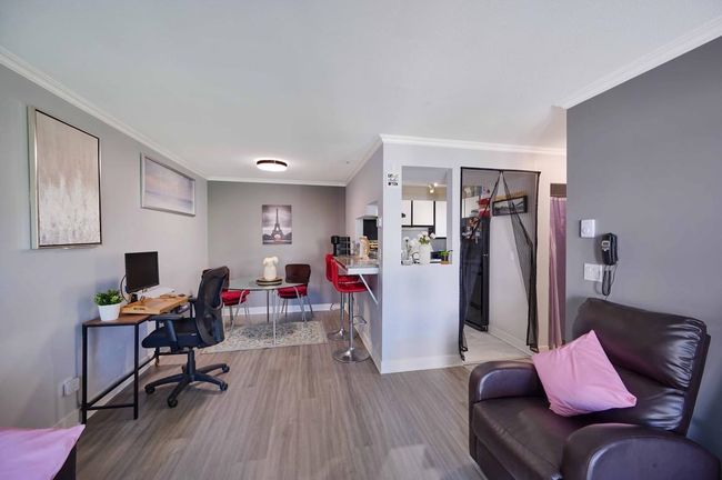 Home office with crown molding, baseboards, and wood finished floors | Image 5