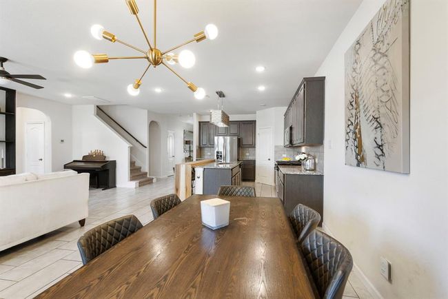 Another view of the dining area overlooking the open kitchen & living area. | Image 16