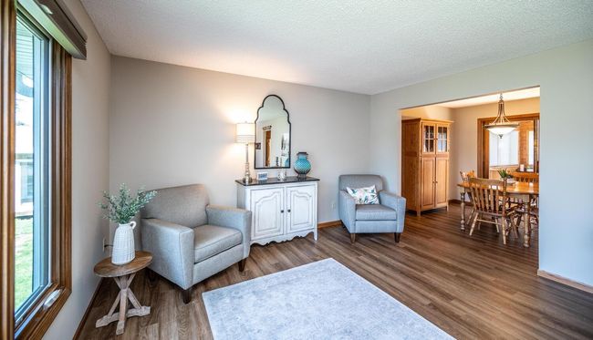 Another view of living room opening to dining room. | Image 7