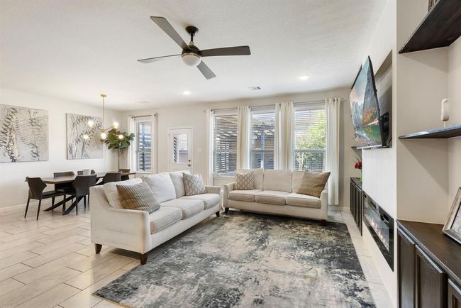 No shortage of natural light in this living area! This bright and airy living room creates the perfect setting for both relaxation and entertaining. | Image 17