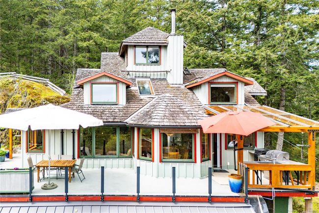 Front of the home where almost all the rooms take in the ocean and mountain views high above the tree tops | Image 8