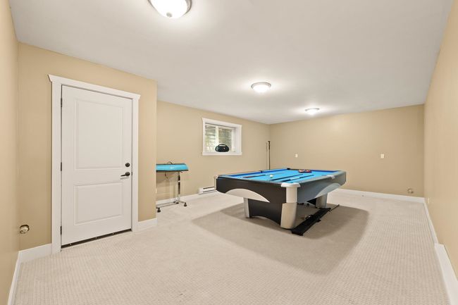 Game room featuring carpet, billiards table, and a baseboard heating unit | Image 24