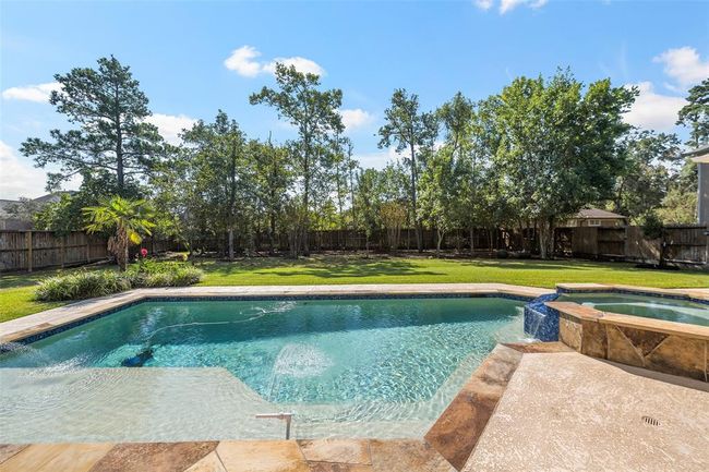 with a great view of the heated pool & spa that was installed in 2018 and | Image 26