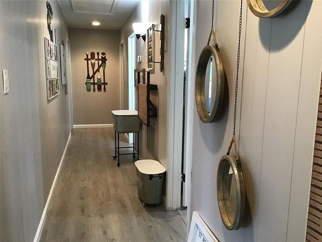 Laundry station outside of the bathroom for folding convenience. | Image 30