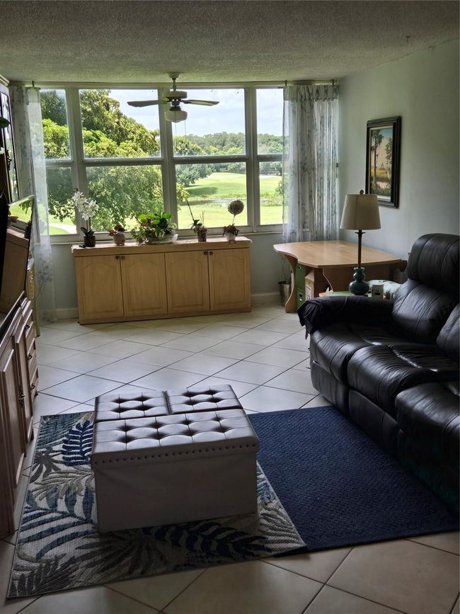Living Room with Enclosed Patio With Hurricane Windows | Image 59