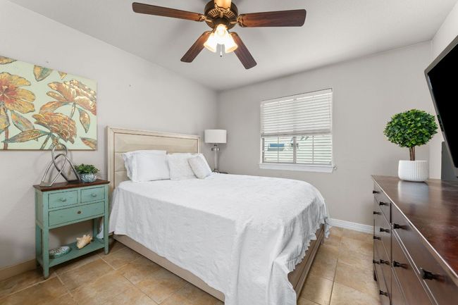 Bedroom with baseboards and ceiling fan | Image 18