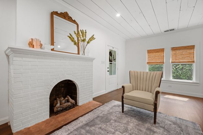 Sitting room with wood finished floors, ornamental molding, wooden ceiling, and recessed lighting | Image 5