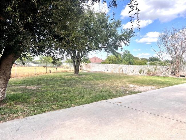 View of yard featuring a patio and fence | Image 9