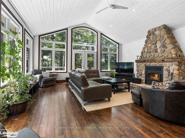 Floor to ceiling stone wood burning fireplace | Image 11