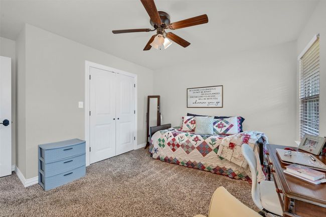 Carpeted bedroom featuring a closet, ceiling fan, and baseboards | Image 22