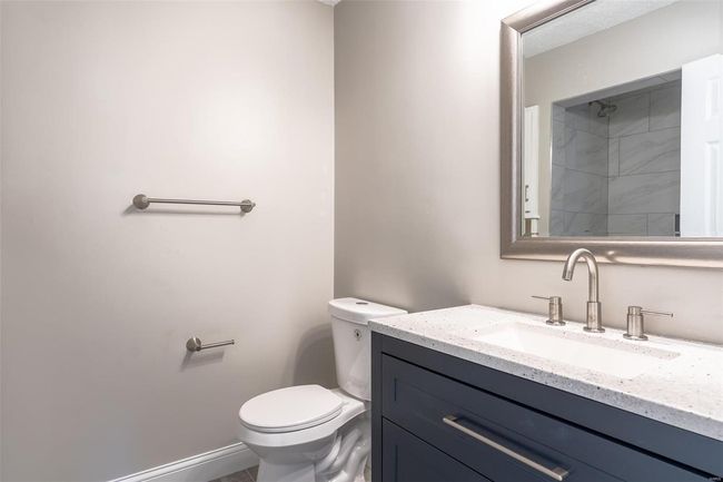 Bathroom featuring vanity and toilet | Image 27