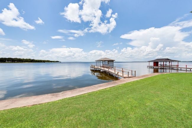 And of course...your have your own private boathouse, with a steel retaining wall and concrete sidewalk to keep your shoreline protected. | Image 32