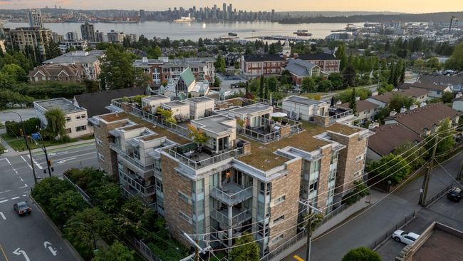View of urban area featuring a nearby body of water | Image 32