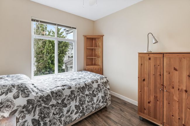 Bedroom with baseboards and dark wood-style floors | Image 25
