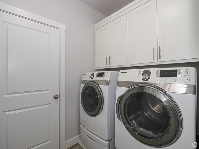 Laundry area featuring cabinet space, and washer and dryer | Image 29