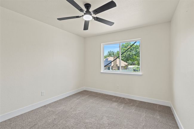 Spare room featuring carpet floors and a ceiling fan | Image 24