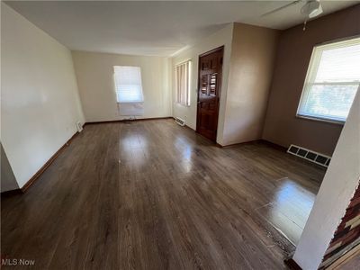 Spare room featuring dark hardwood / wood-style floors and ceiling fan | Image 3