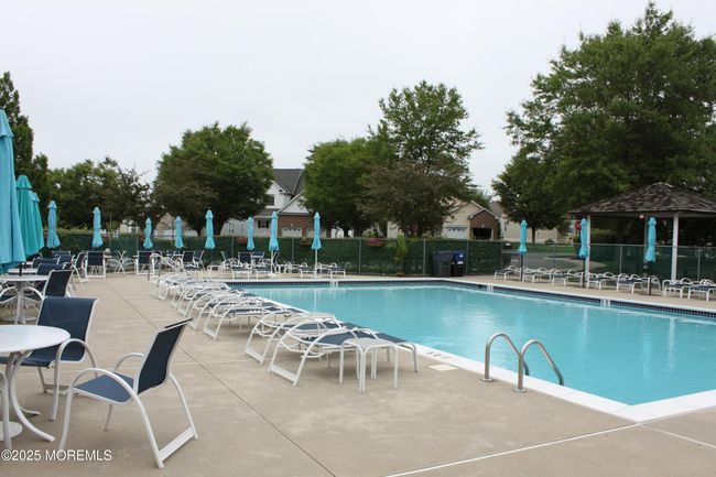 Spacious outdoor pool area. | Image 28